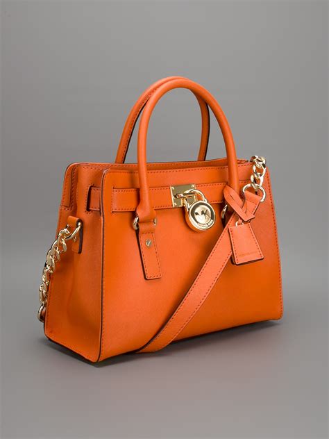 Michael Kors orange totes